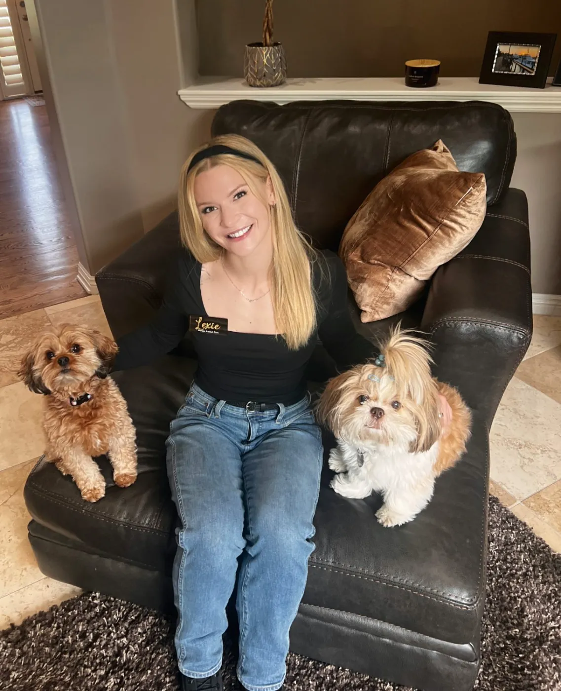 Lexie at home with two small dogs — in-home house sitting and pet care in Denver