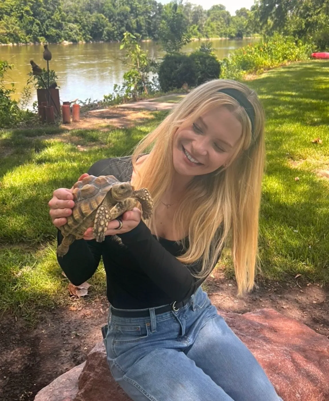 Lexie holding a tortoise — exotic and reptile pet care by a zoologist near Denver